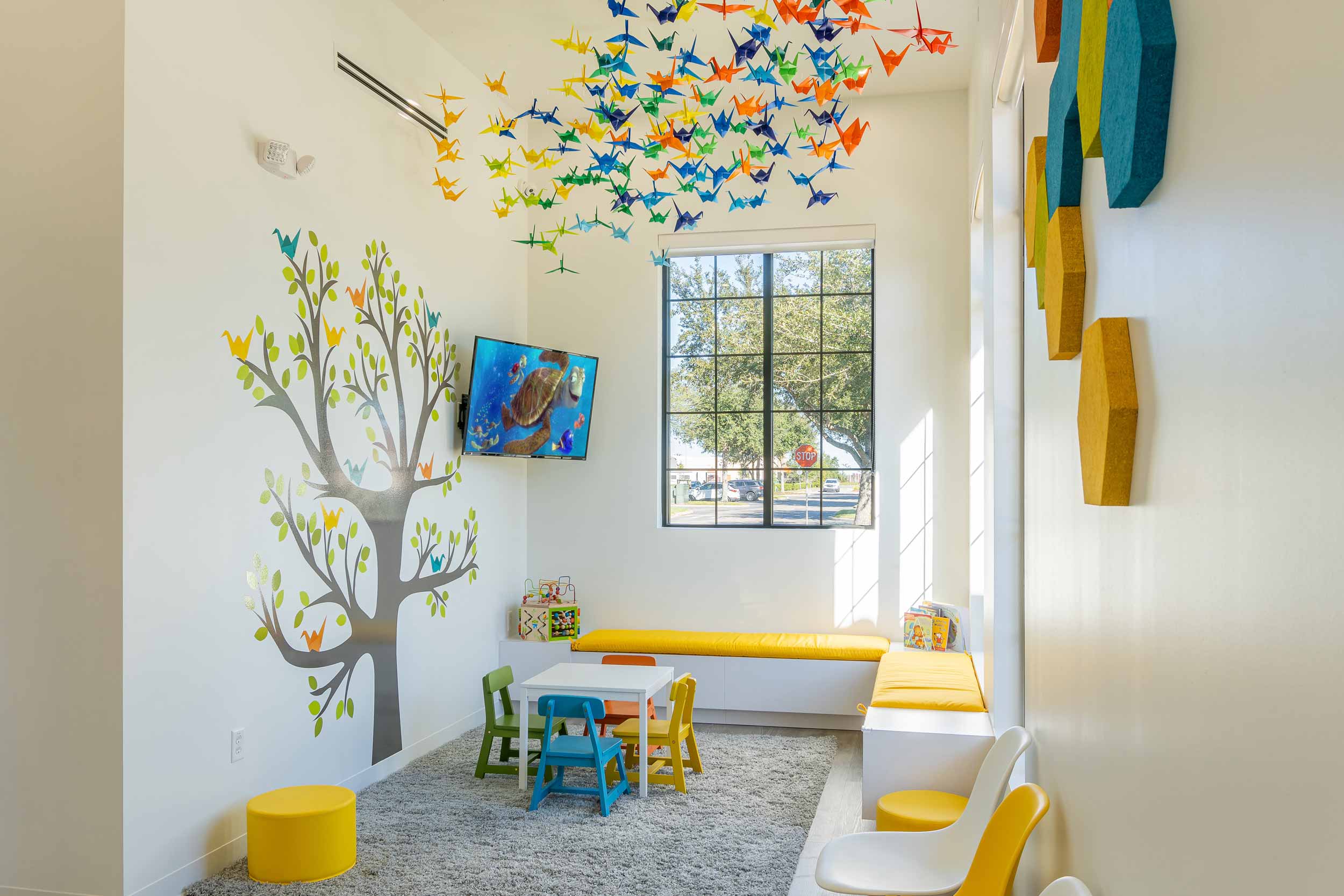 Children friendly play area in the lobby of kids dentist office.