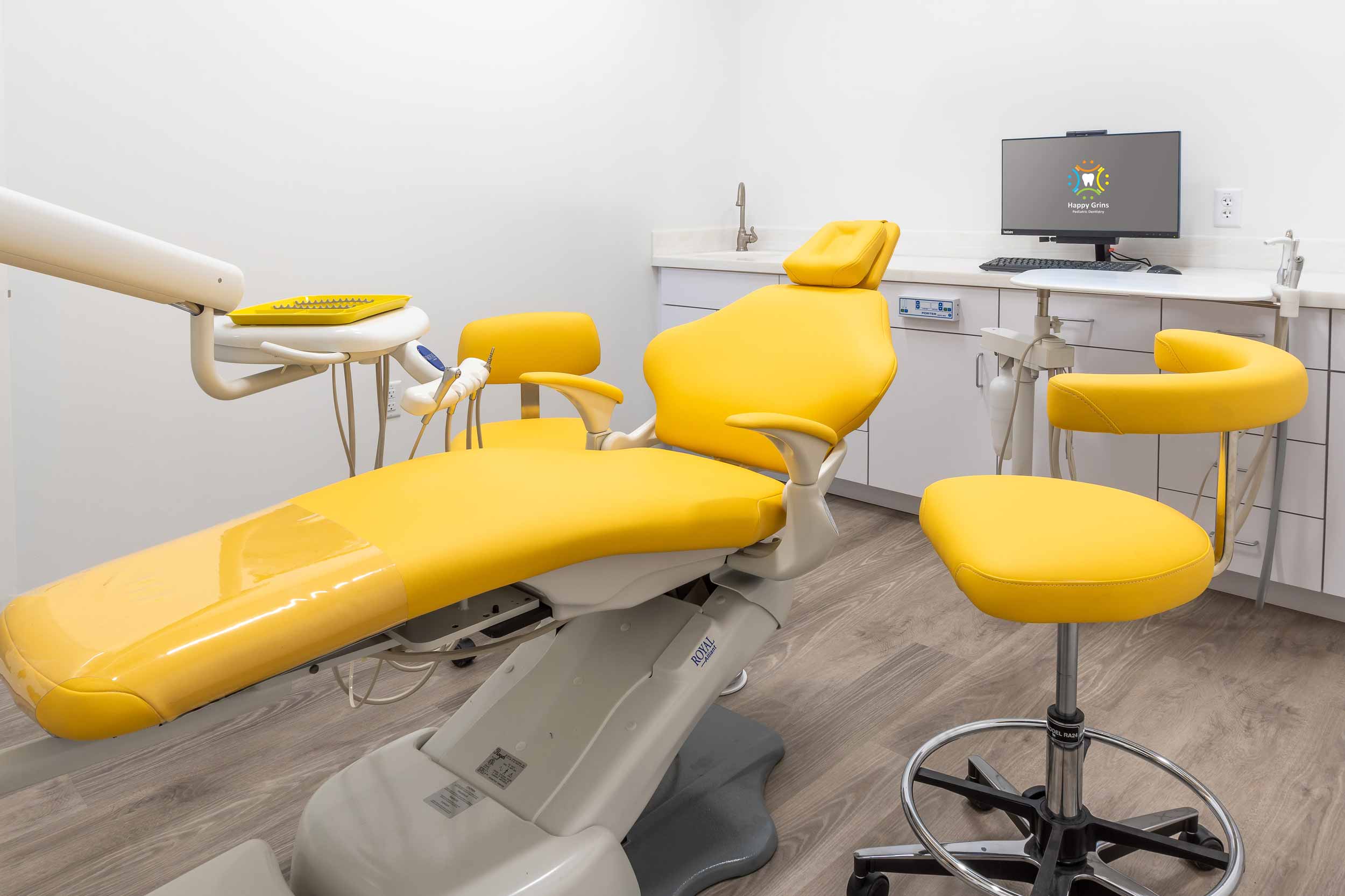 Colorful kids dental chair at Happy Grins Pediatric Dentistry, welcomes toddlers, children, and  teens.