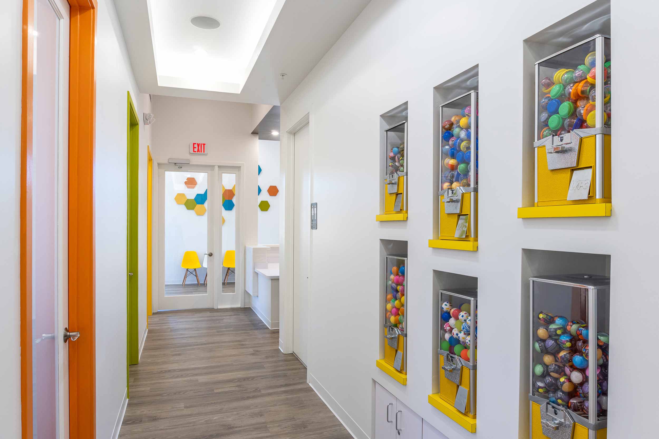 Reward wall at kids dentist encourages children to see the pediatric dentist regularly.